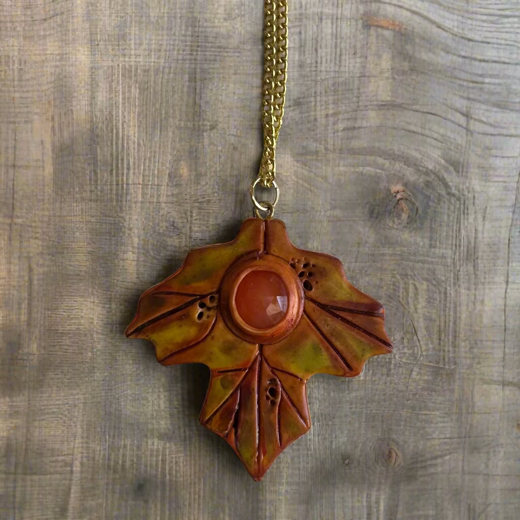 handmade polymer maple leaf with faceted carnelian