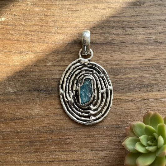 raw blue topaz pendant in sterling silver