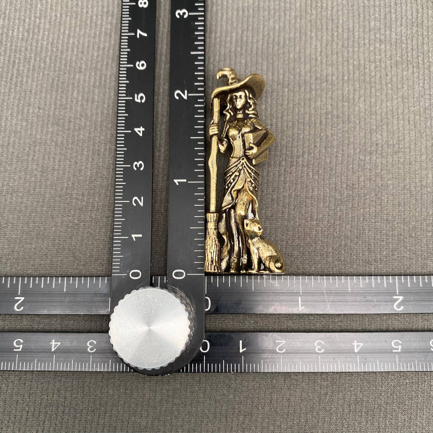 brass witch figurine
