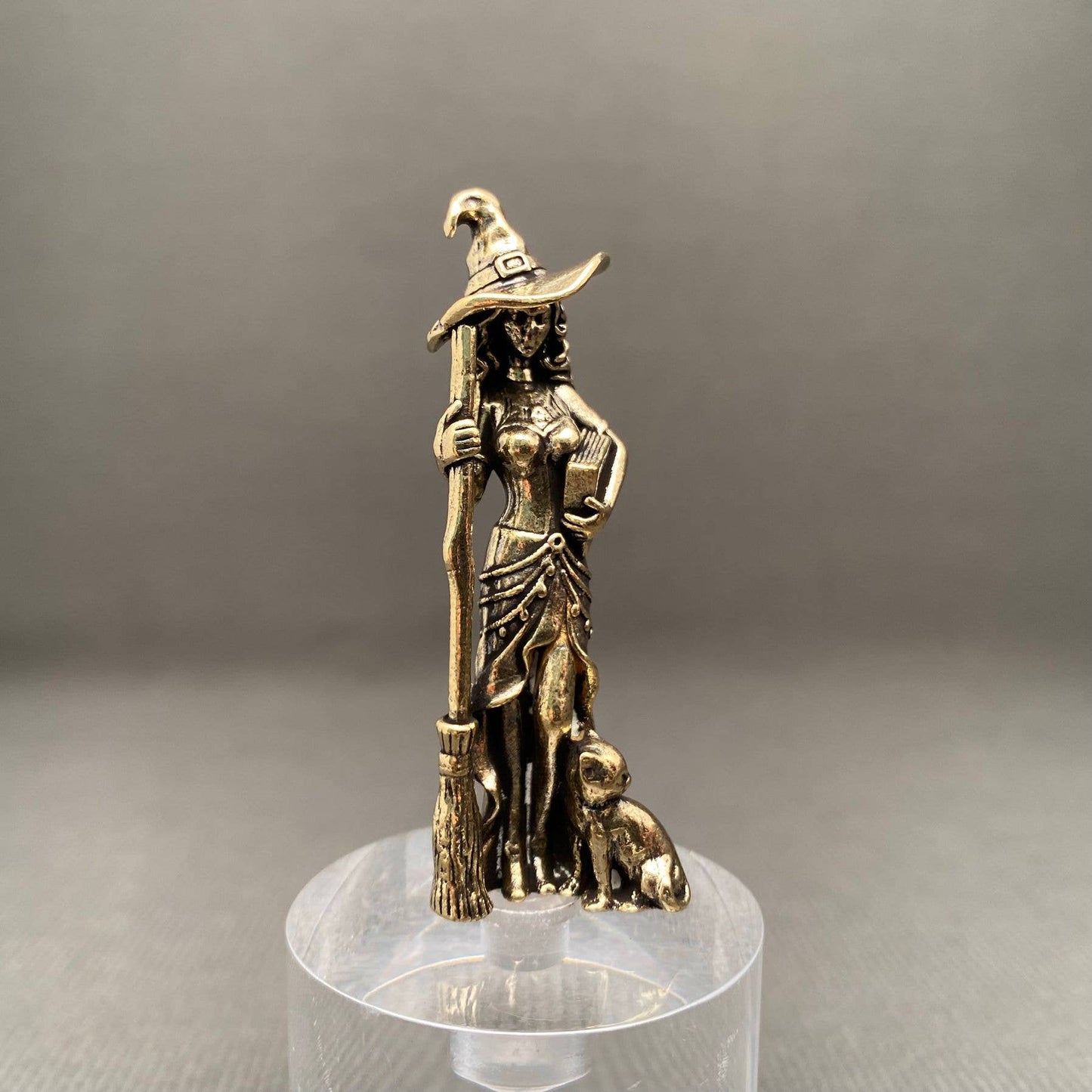 brass witch figurine