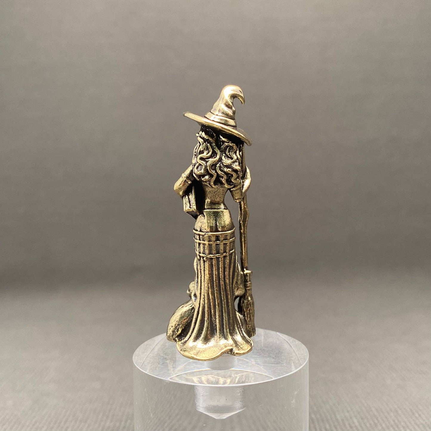 brass witch figurine