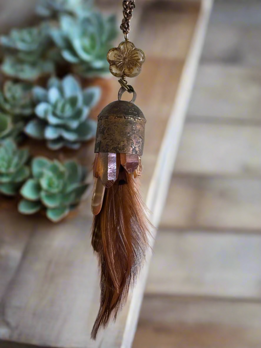 brass bell pendant with aura quartz, urchin spines, feathers on copper chain