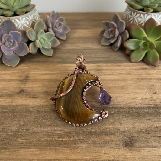 handmade copper-wrapped tiger's eye moon pendant with amethyst