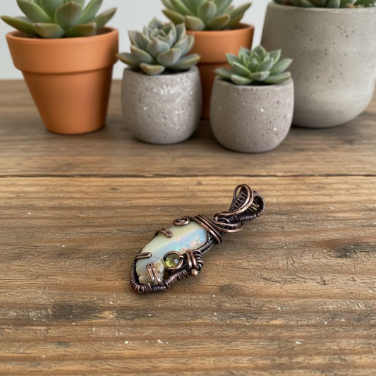 handmade copper-wrapped raw opal pendant with peridot