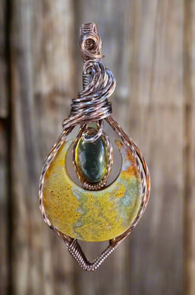 handmade copper-wrapped bumblebee jasper and amber pendant