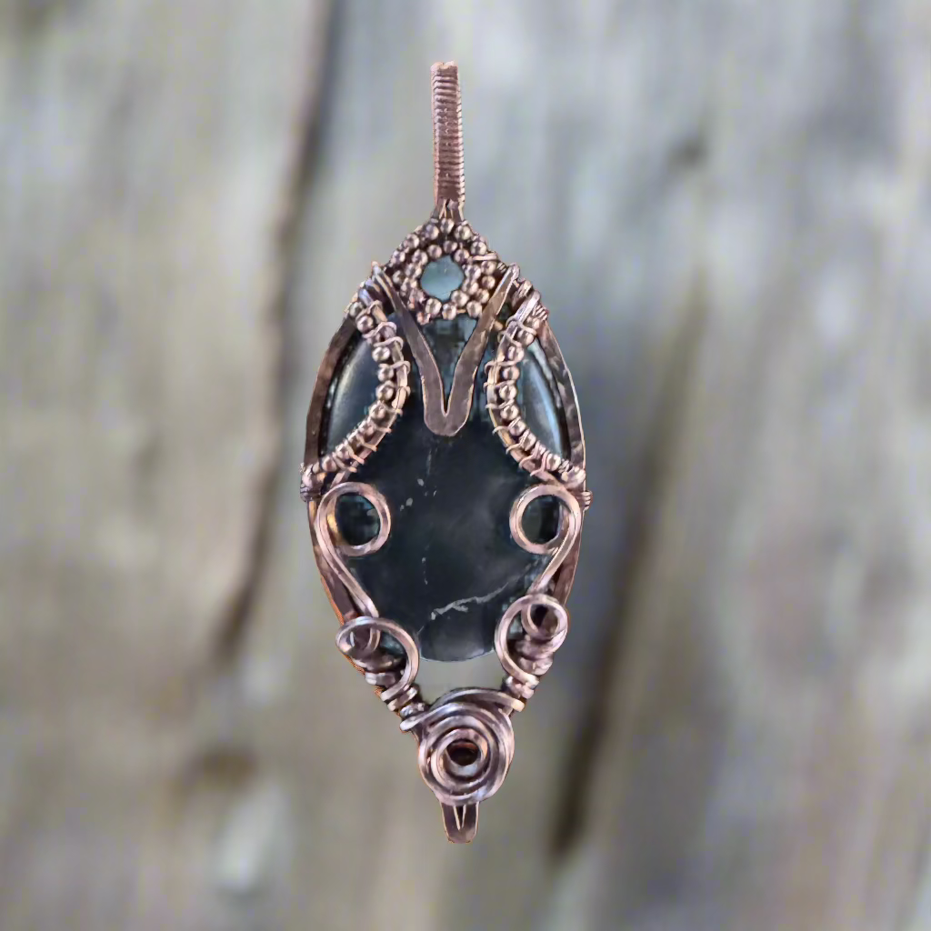 handmade copper-wrapped shungite and pyrite pendant