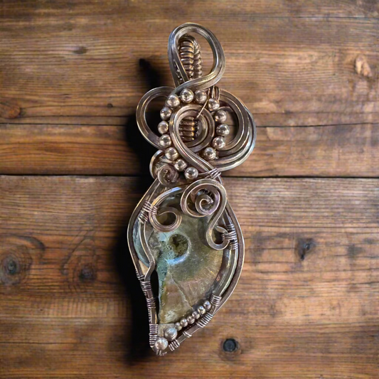 handmade copper-wrapped fossilized ammonite pendant