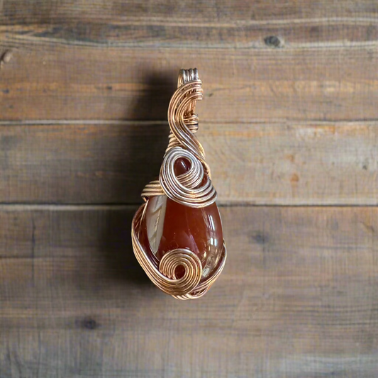 handmade copper-wrapped carnelian pendant