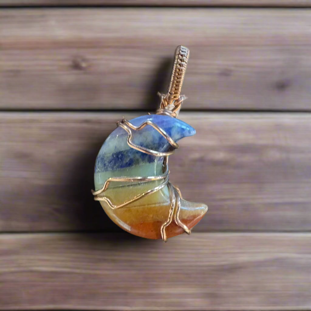 handmade copper-wrapped chakra moon pendant