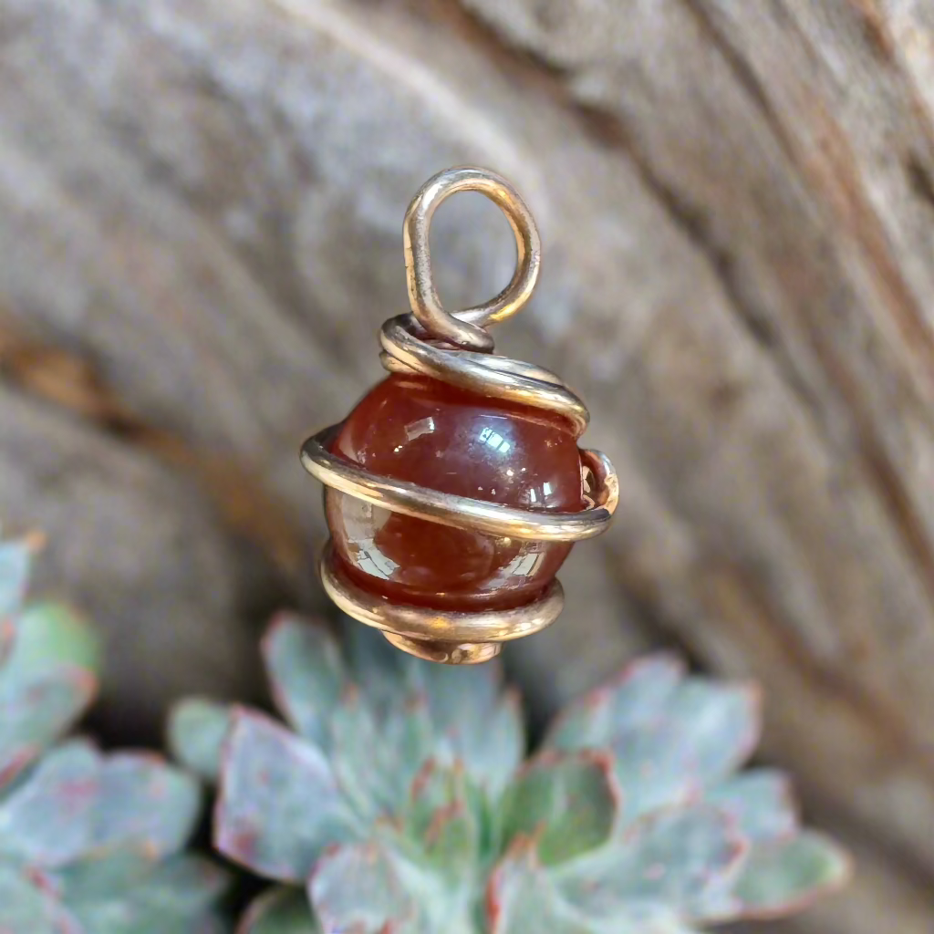 handmade copper-wrapped carnelian sphere