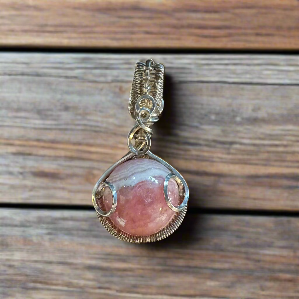 handmade rhodochrosite sphere wrapped in sterling silver