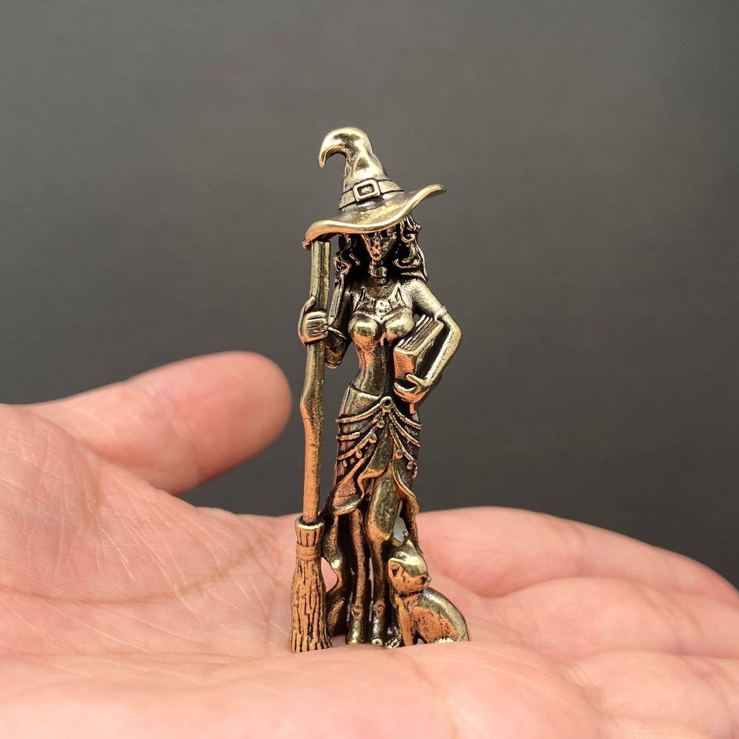 brass witch figurine